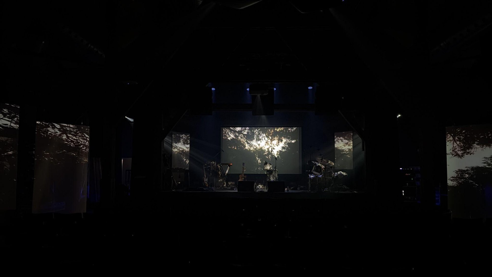 The Sun at Godset, Kolding — front-facing projection with loudspeakers surrounding the audience